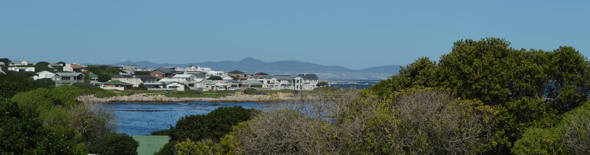 The view across Onrus lagoon to the sea with the Kleinrivier mountains beyond